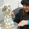 Marianna glazing Zeus hand